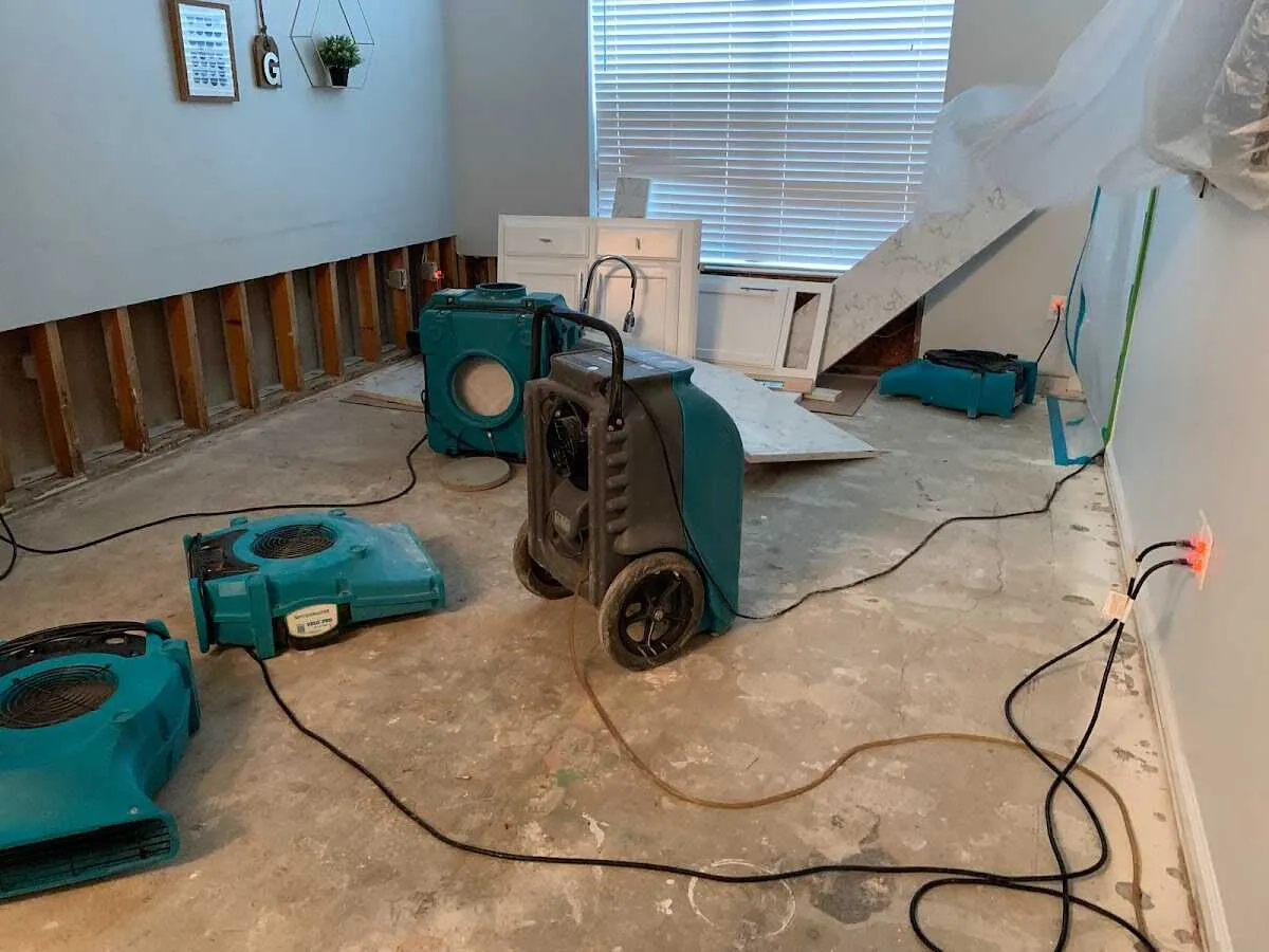 Dehumidifier in flood-cut room for Water Damage Restoration in Riverdale